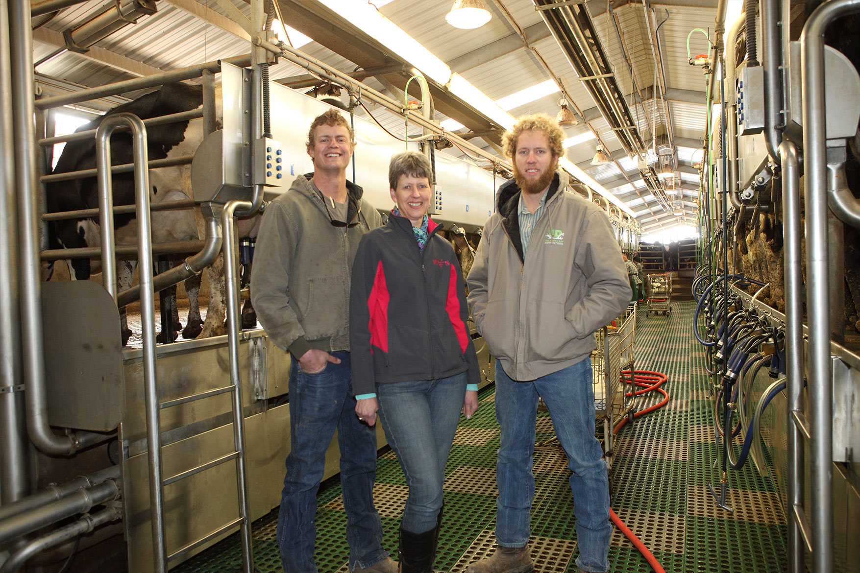 The DeVos family inside the milking parlor at Fox Dairy.