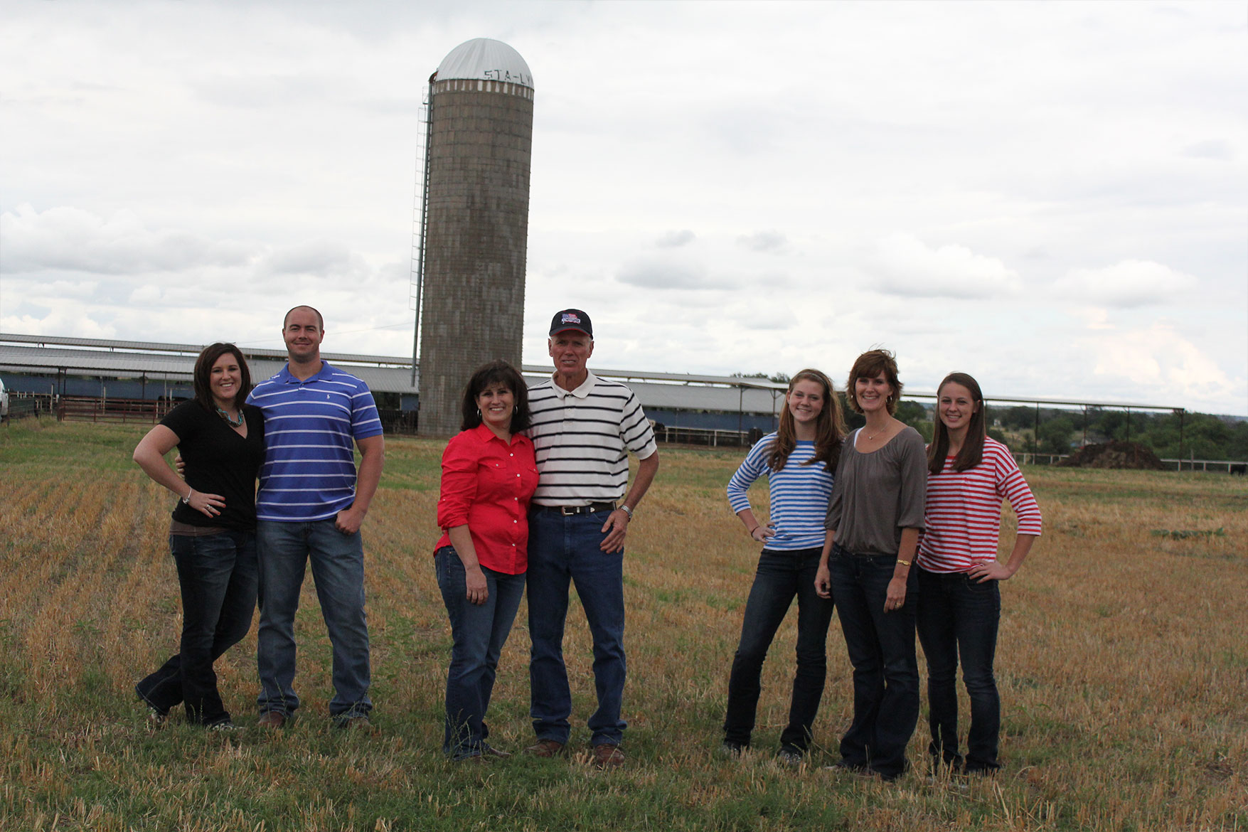 The whole Haedge family poses for a photo in front of the dairy.