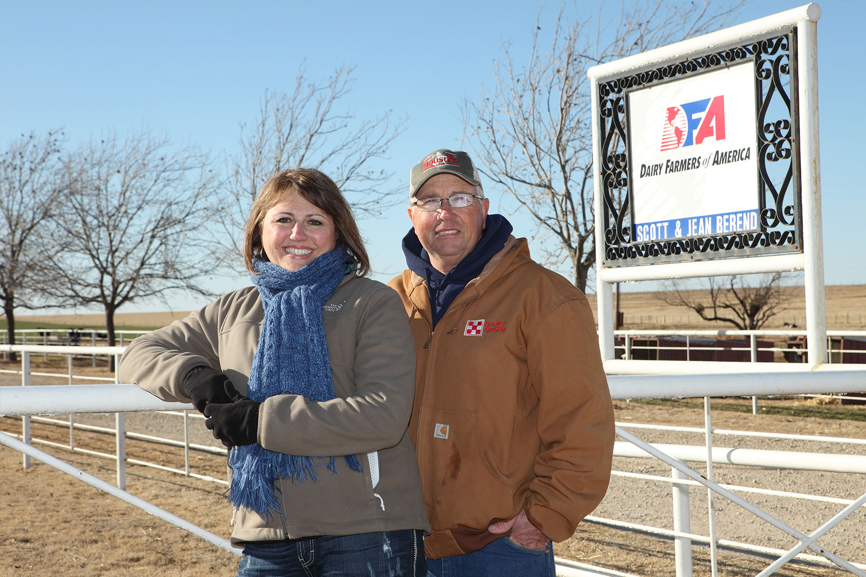 Scott and Jean Berend pose for a photo in front of their dairy sign.