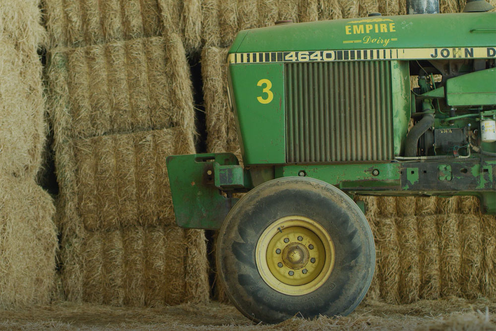 A custom-painted tractor has the Empire Dairy logo.