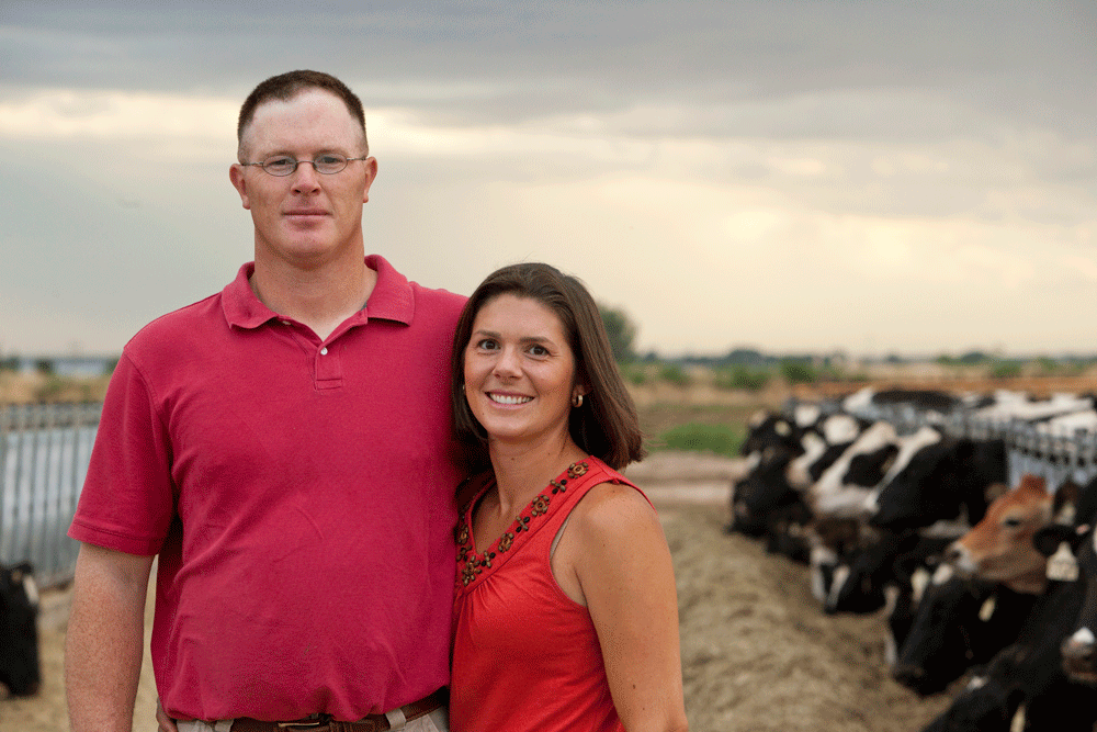 Steve and Ashley Edstrom pose in front of their herd.