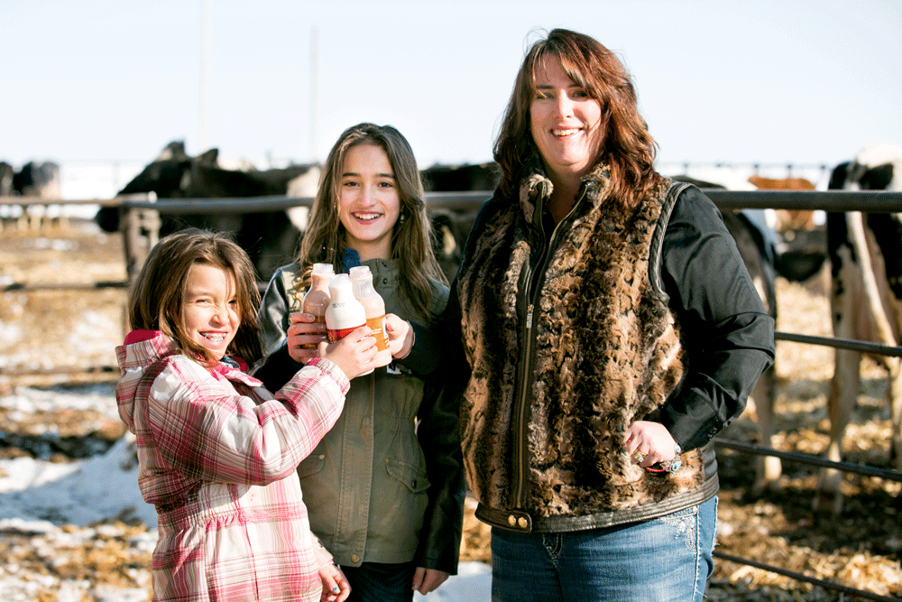 Shelly and her daughters enjoy some milk together.
