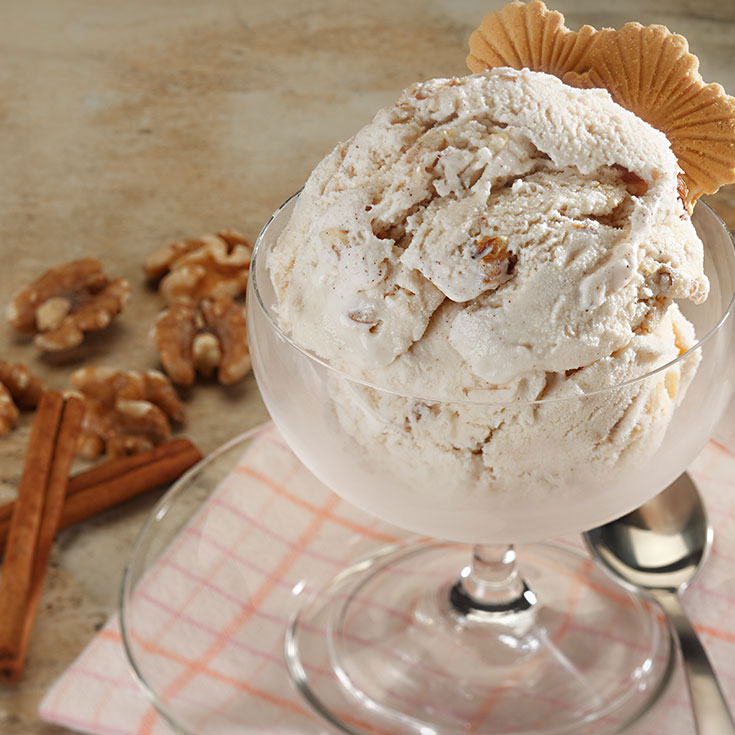 cinnamon walnut ice cream in a glass serving bowl