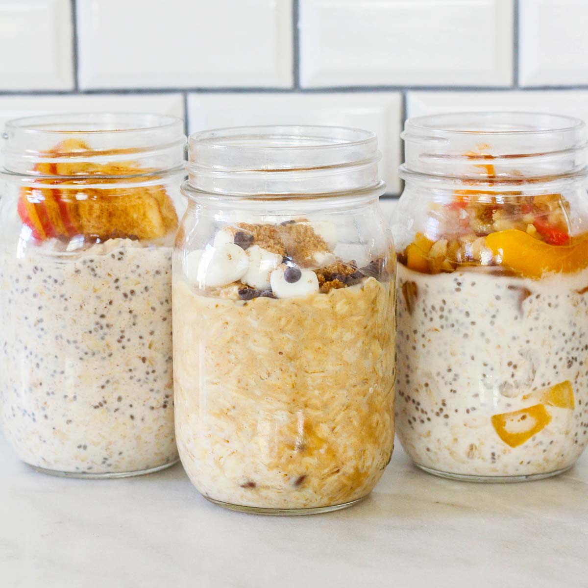 three jars with overnight oats in each and different toppings