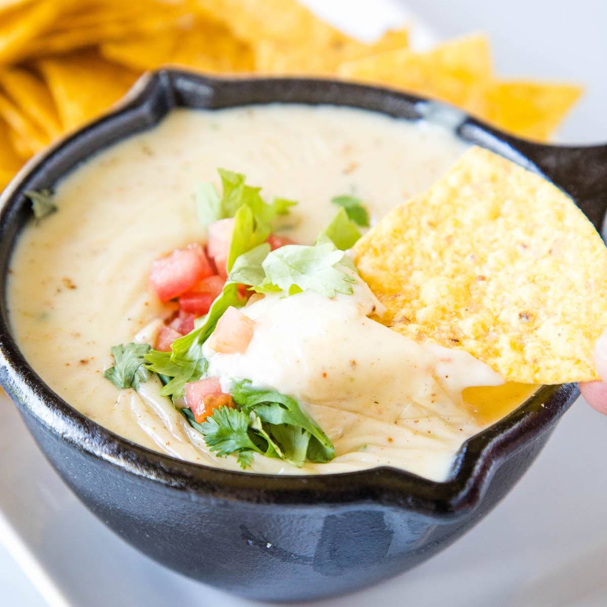 queso in a cast iron skillet