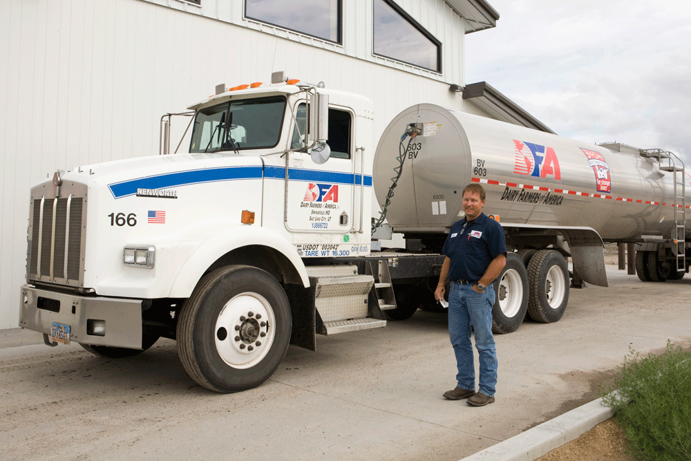 One of the drivers who picks up milk from Quail Ridge Dairy poses in front of his truck.
