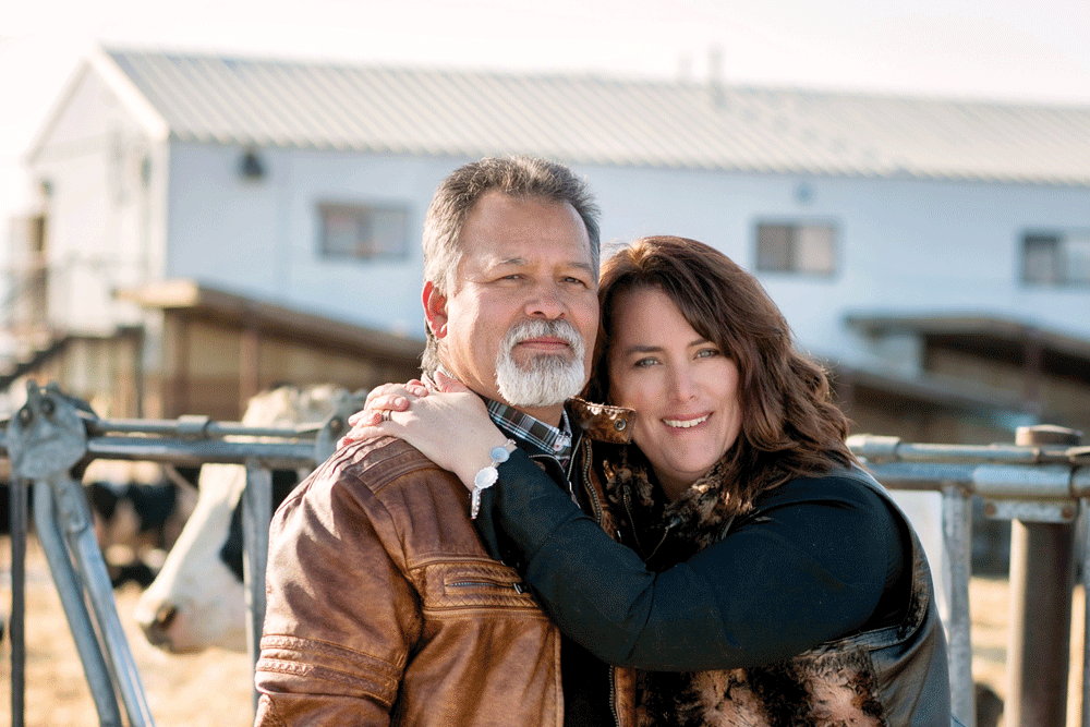 Martin and Shelly pose in front of their dairy farm.