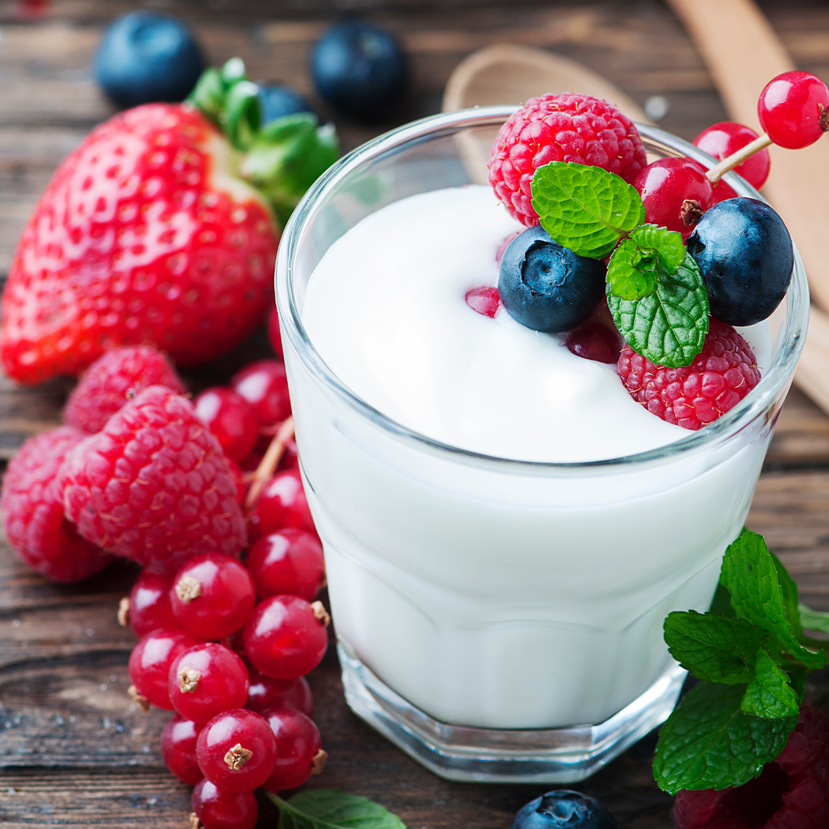 Glass of milk with berries