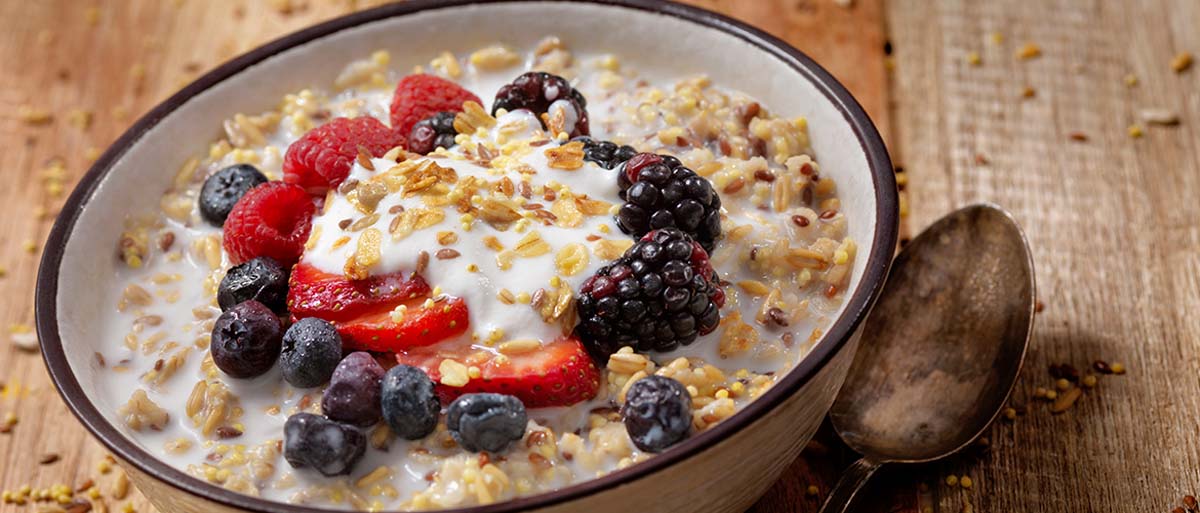 bowl of oatmeal with fruit on top