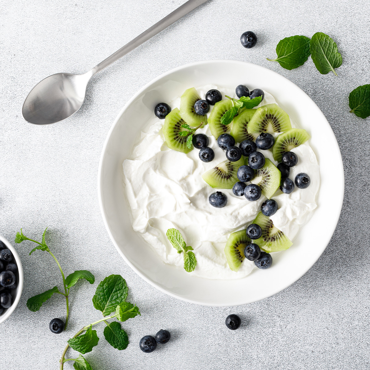 Lactose free yogurt with blueberries and kiwi
