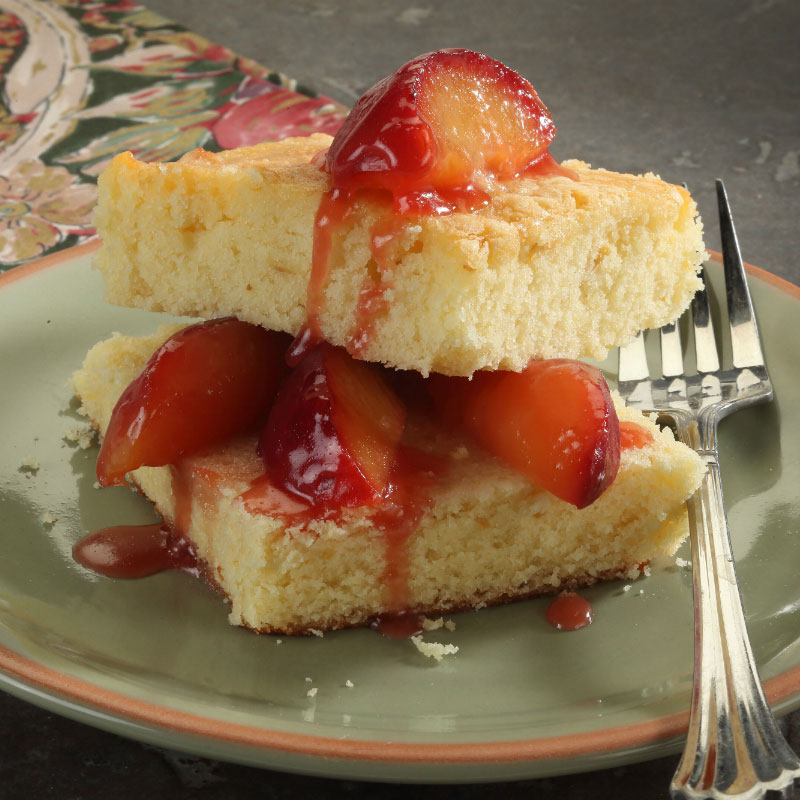 pound cake on a plate with strawberry topping