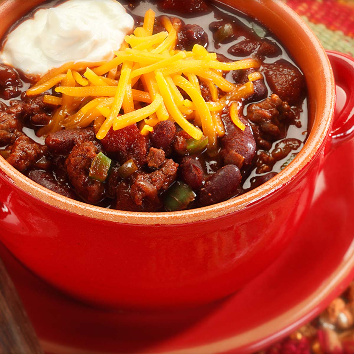 slow cooker chili in a red bowl