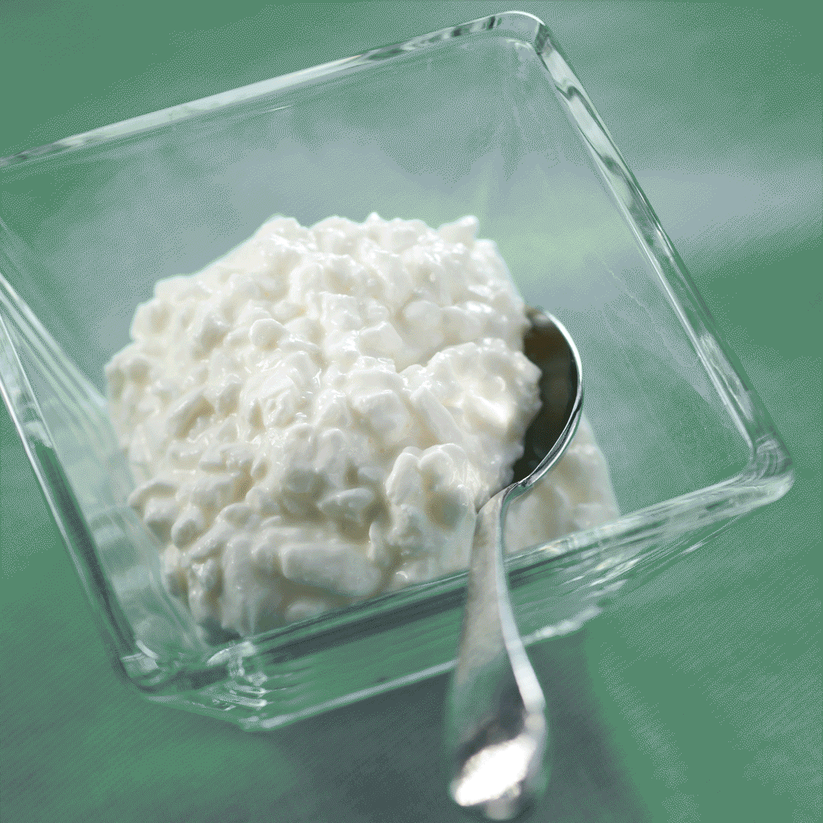 cottage cheese in a bowl with a spoon