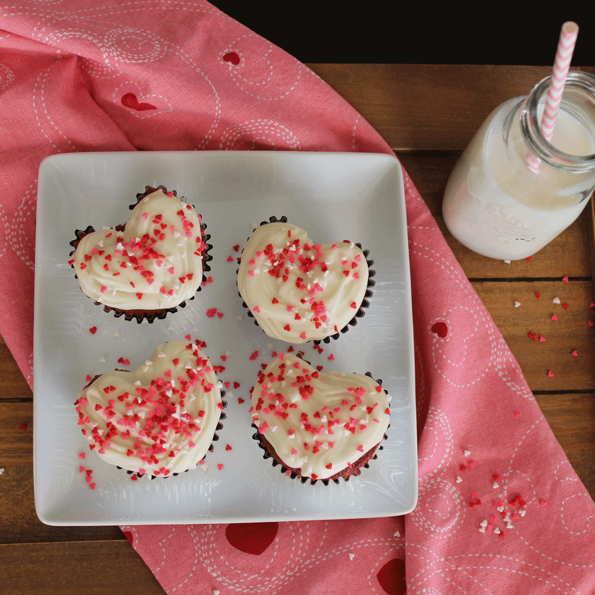 heart-shaped red velvet cupcakes with cream cheese frosting